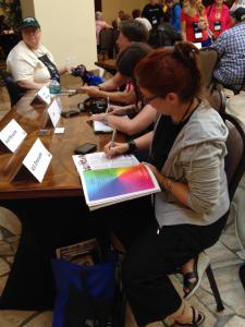 Me signing a program